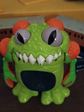 Fisher-Price Bright Green Monster Figure with Orange & Purple Accents
